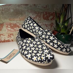 TOMS Black and White Daisy Slip-Ons